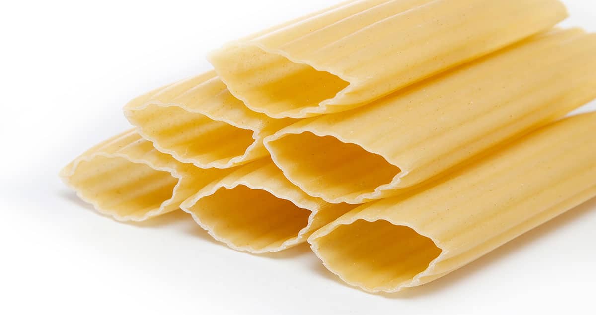 Manicotti pasta on a white background. 