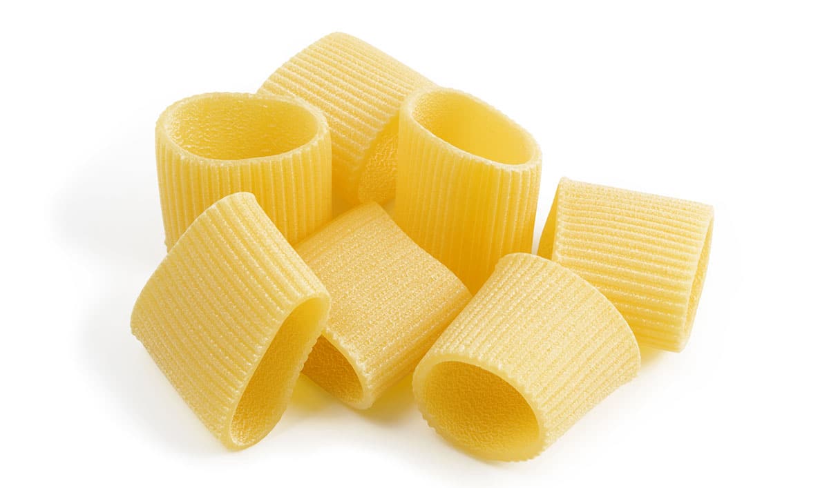 Paccheri pasta on a white background. 