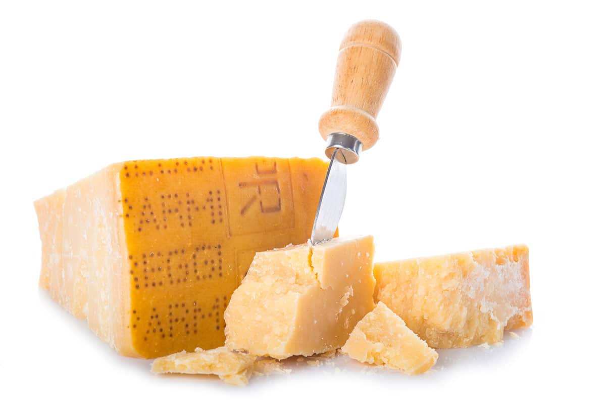 Parmigiano reggiano cheese isolated on a white background.
