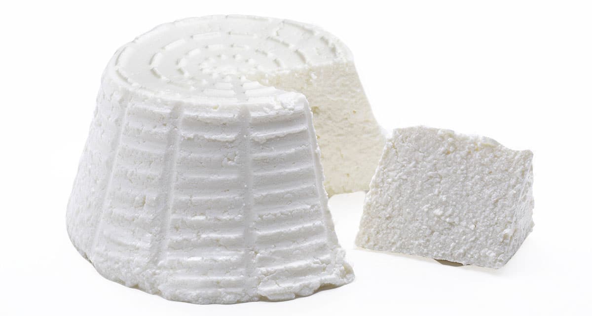Ricotta cheese isolated on a white background.