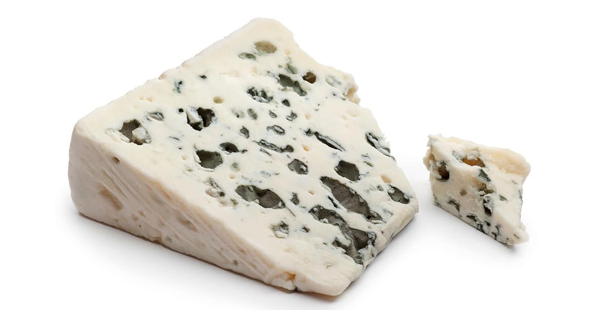 Roquefort cheese isolated on a white background.