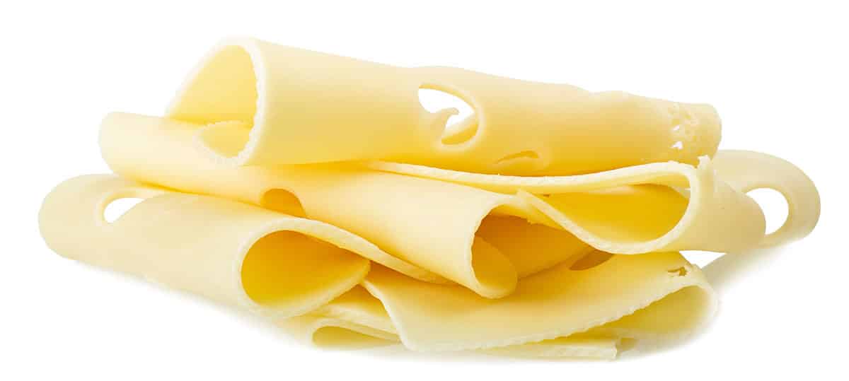 Swiss cheese isolated on a white background.