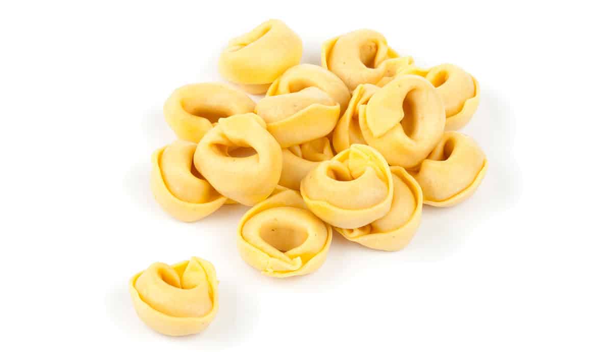 Tortellini pasta on a white background. 
