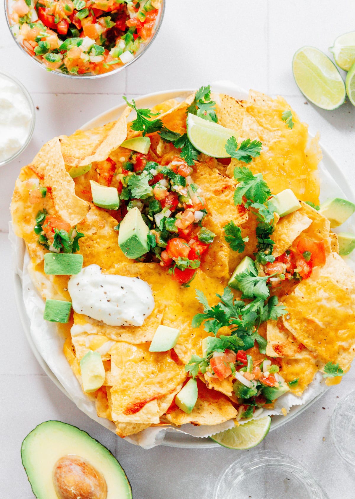 A white platter filled with vegetarian nachos.