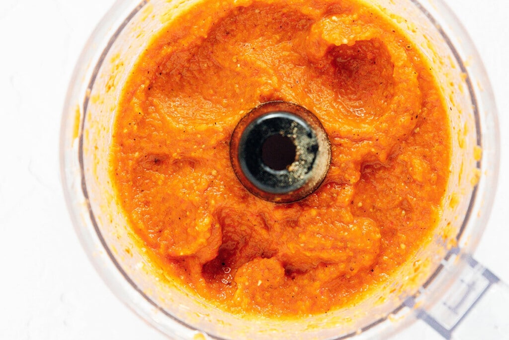 Blend: Add roasted peppers and eggplant to a food processor, along with all other ingredients. Blitz until smooth.