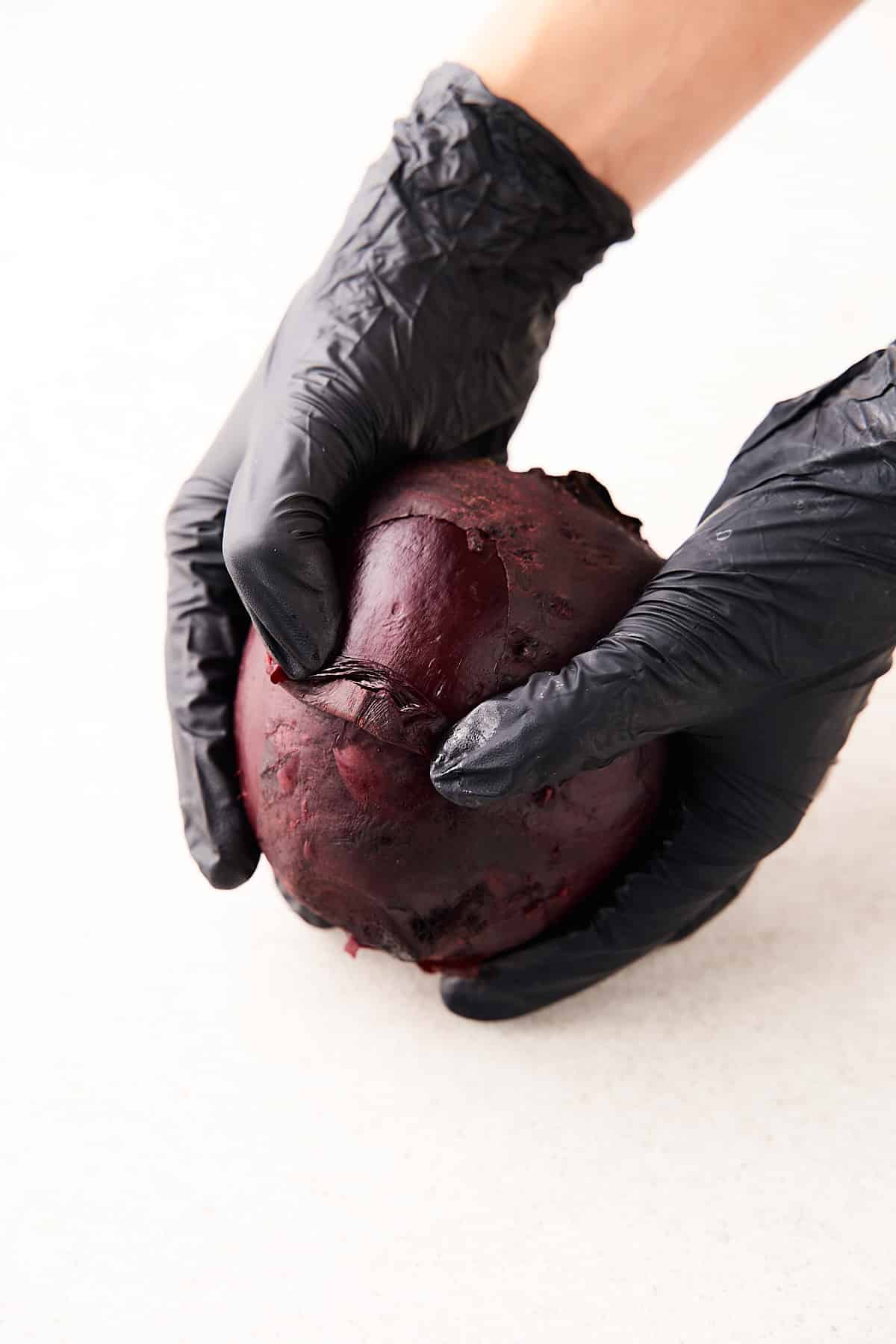 Peeling a cooked beet.