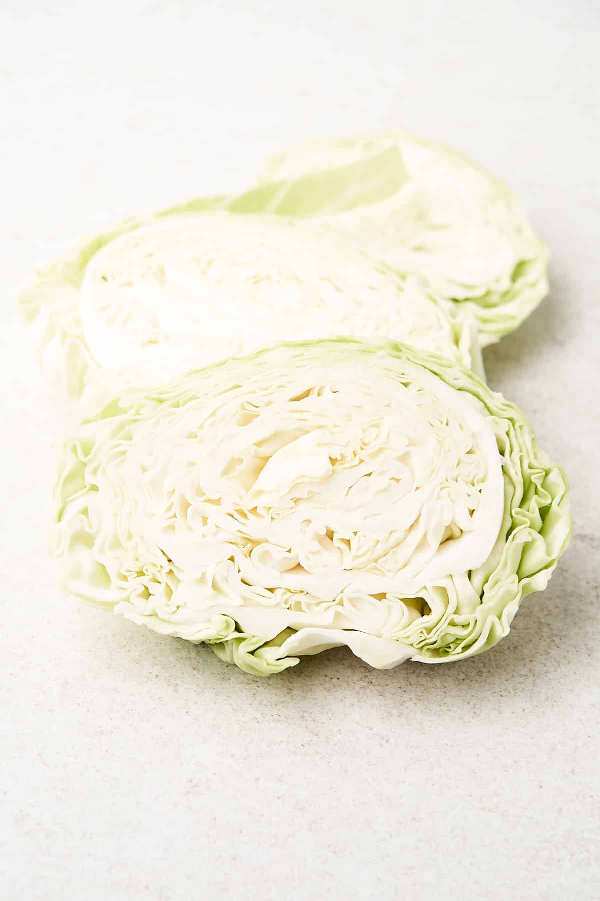 Cabbage steaks on a table.