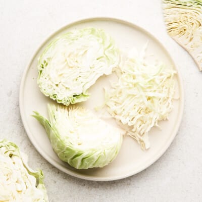 Various cuts of cabbage on a plate.
