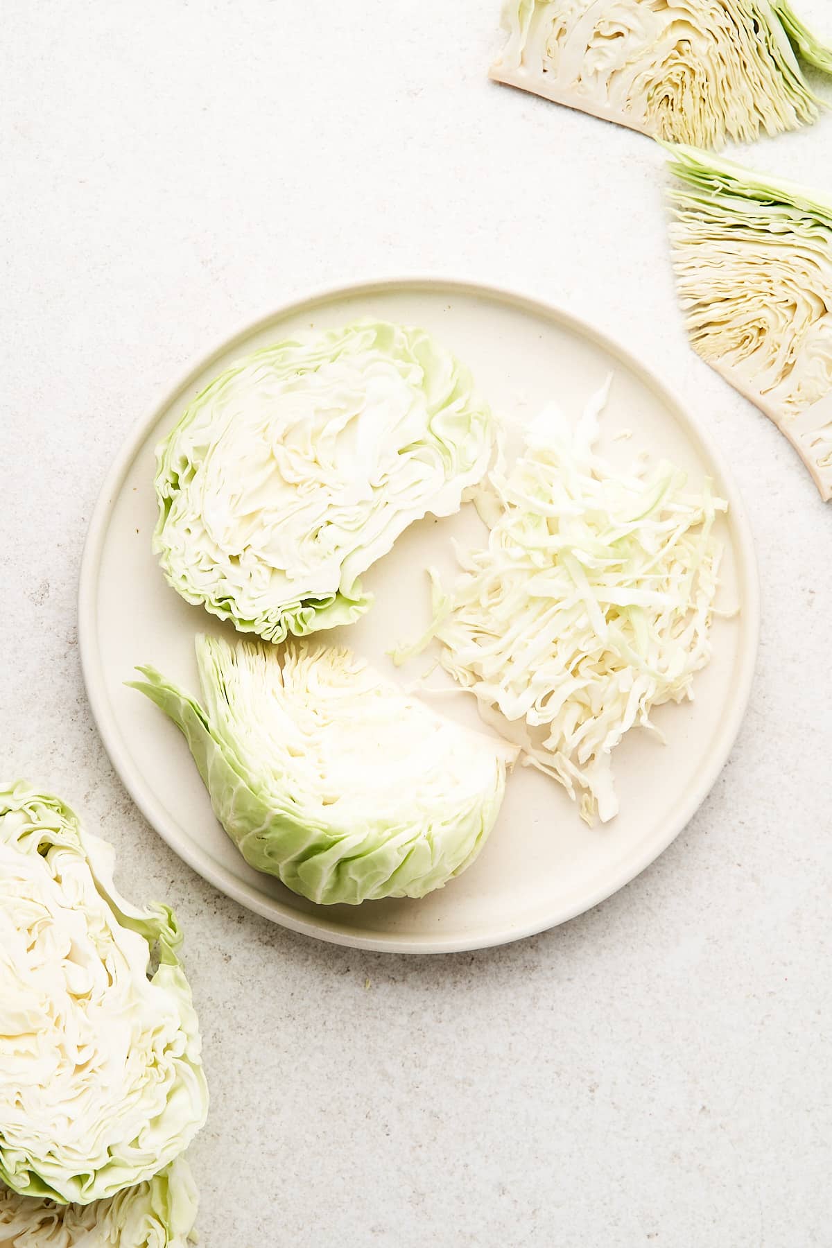 Various cuts of cabbage on a plate.