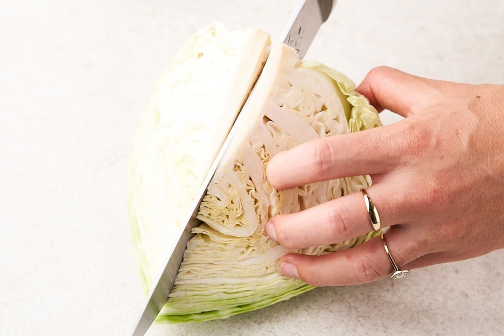 Cutting cabbage into wedges.