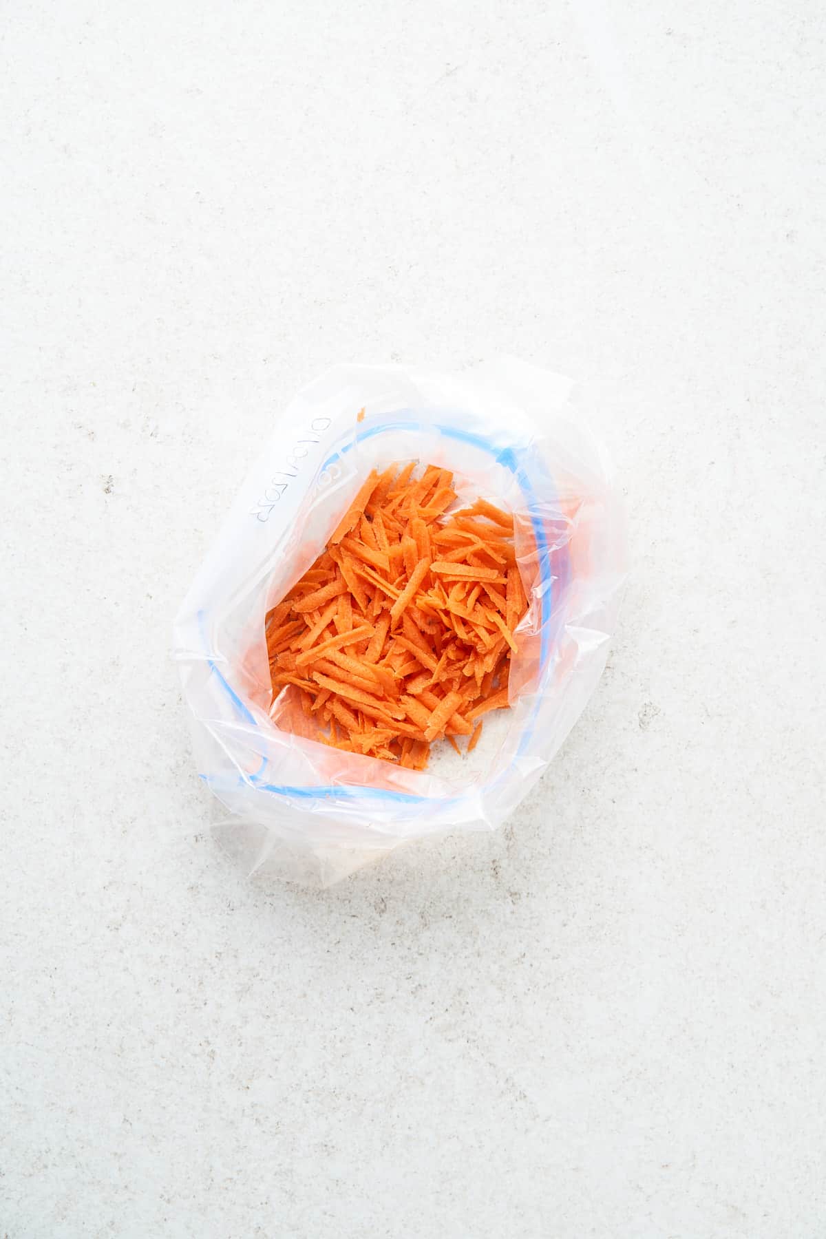 Grated carrots in a freezer bag.