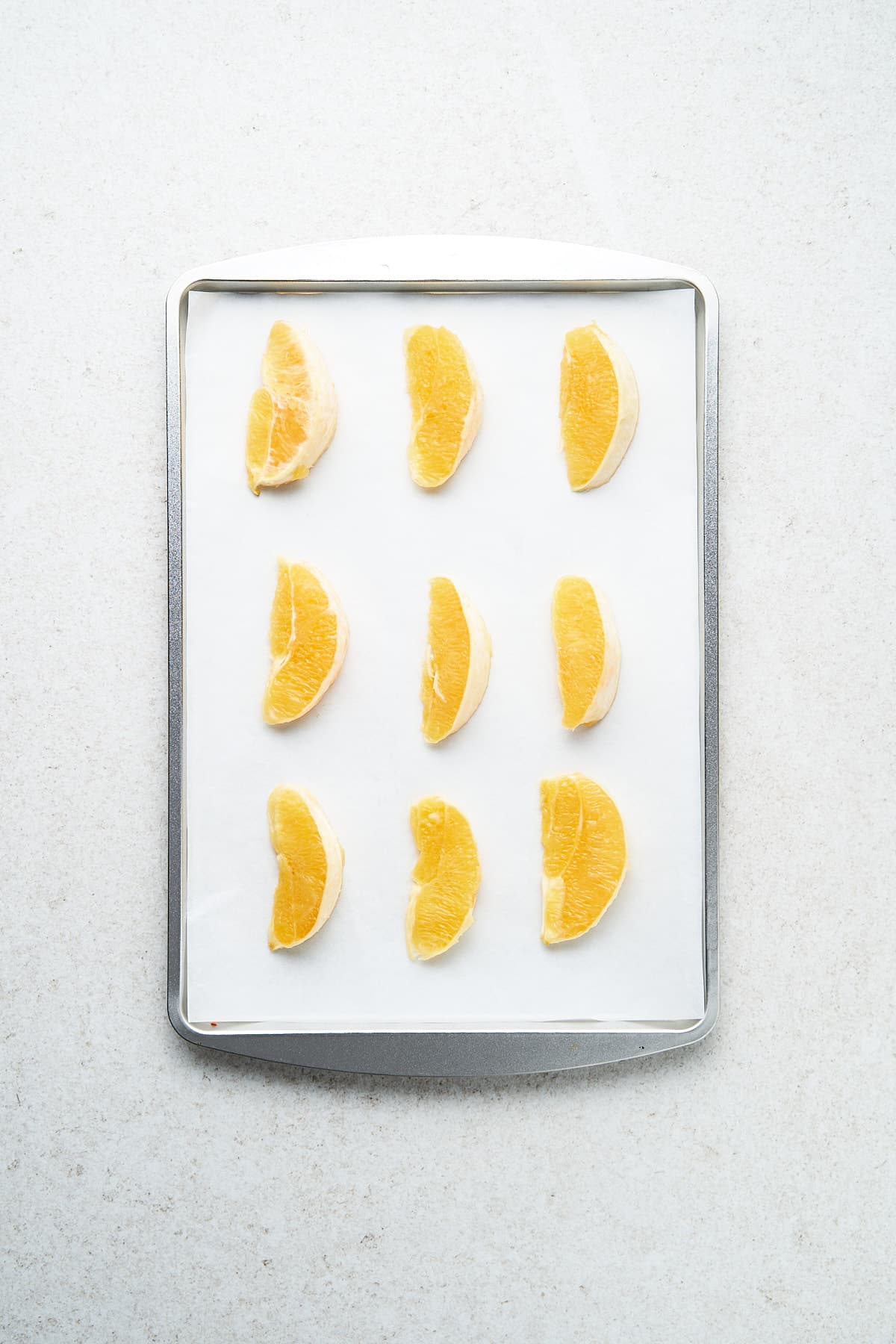 Orange slices on a tray.