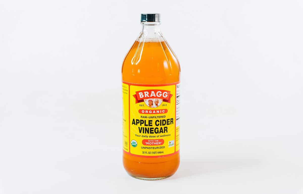 Apple cider vinegar on a white background.