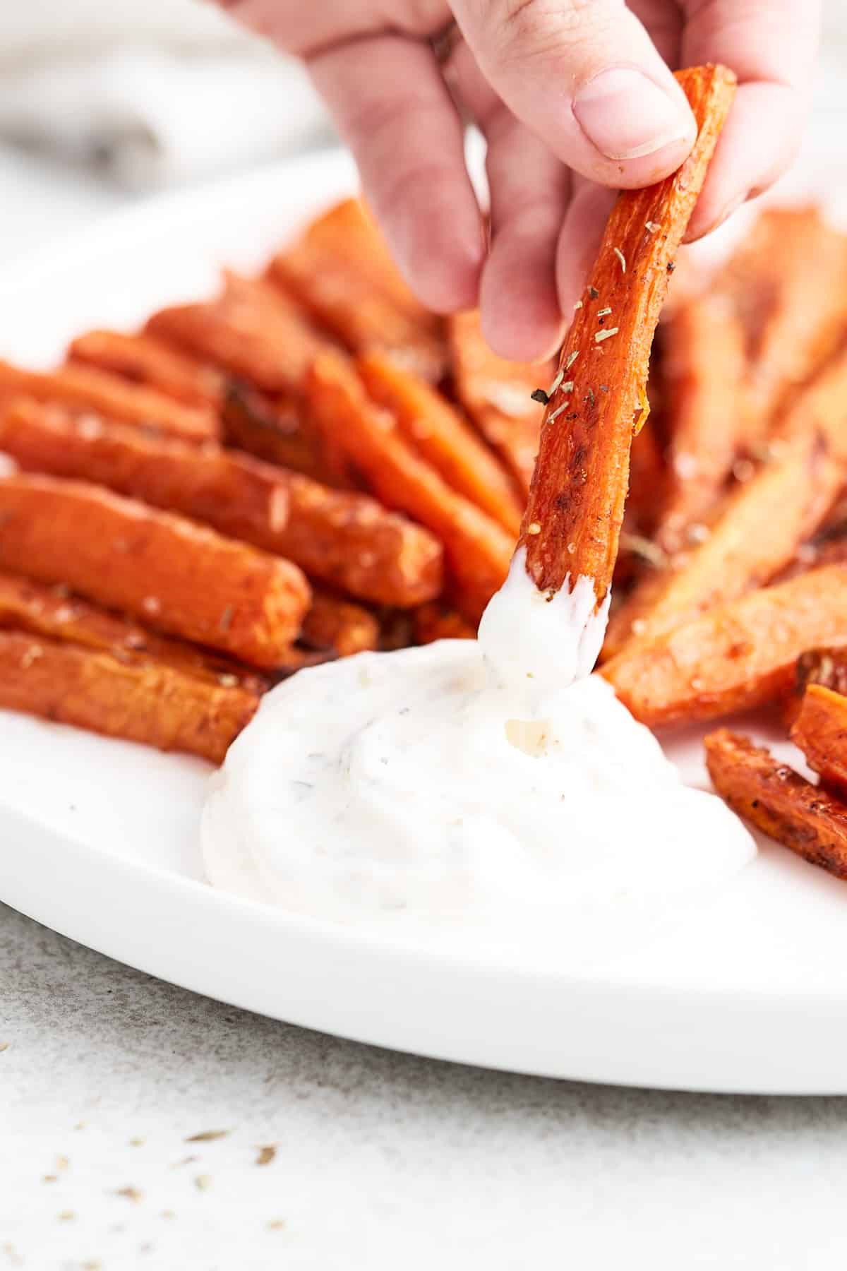 Dipping a carrot fry.