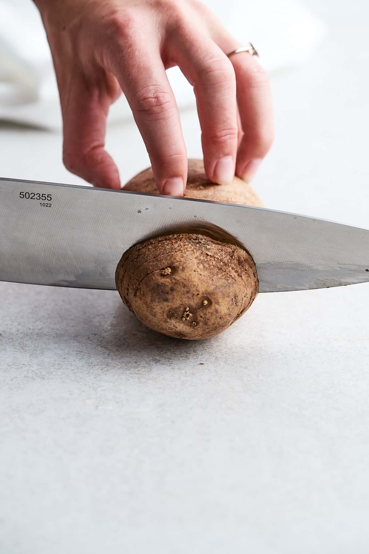 Making a hasselback potato.