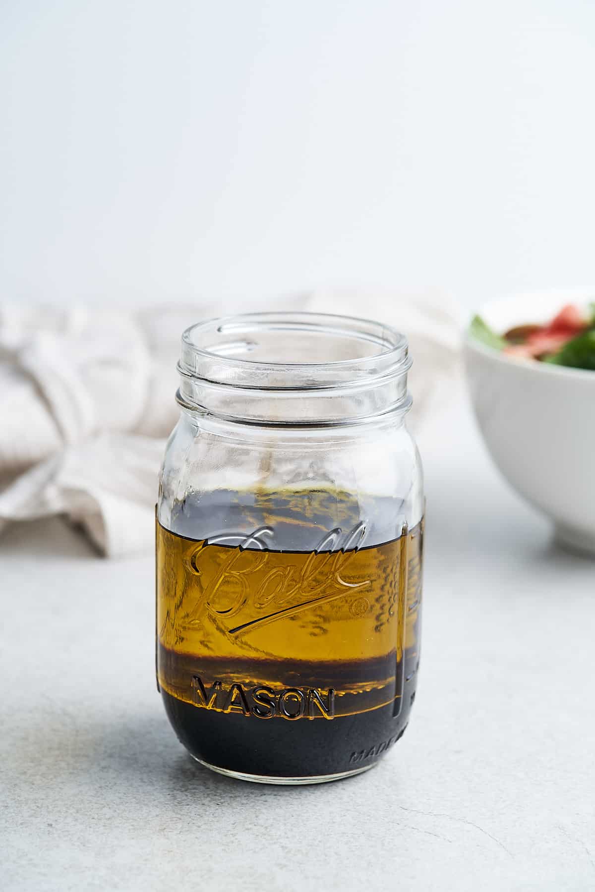 Olive oil and balsamic vinegar in a jar.