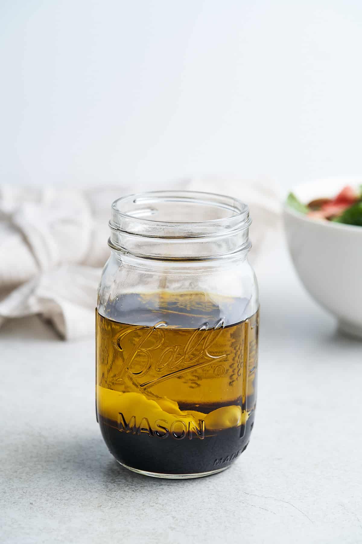 Olive oil, balsamic vinegar, and mayo in a jar.