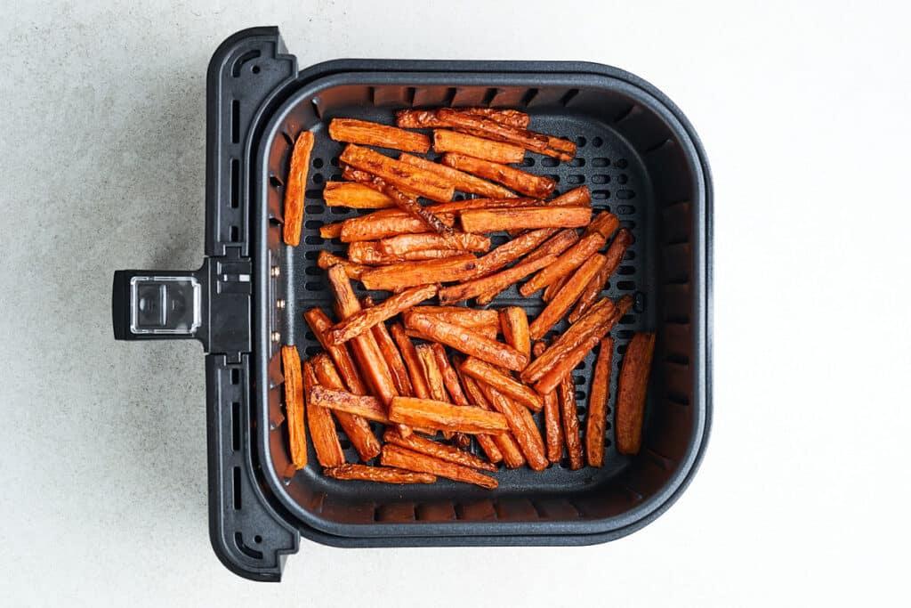 Carrot fries in an air fryer.