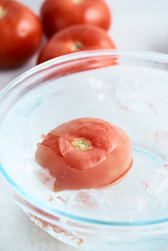 A tomato in an ice bath.