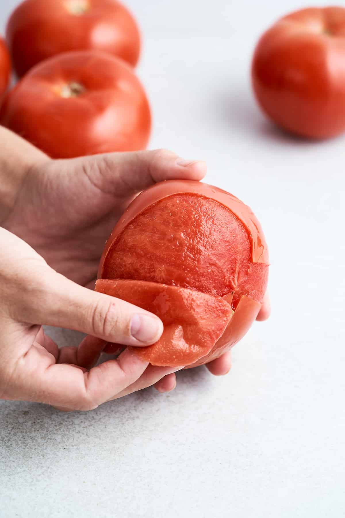 Peeling a blanched tomato.