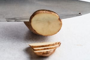 Cutting potatoes into chips.