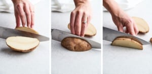 Three side-by-side photos demonstrate how to cut potatoes, showing a hand slicing a russet potato in half on a white surface with a large kitchen knife.