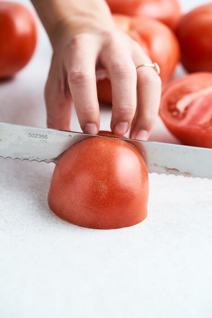Quartering a tomato.