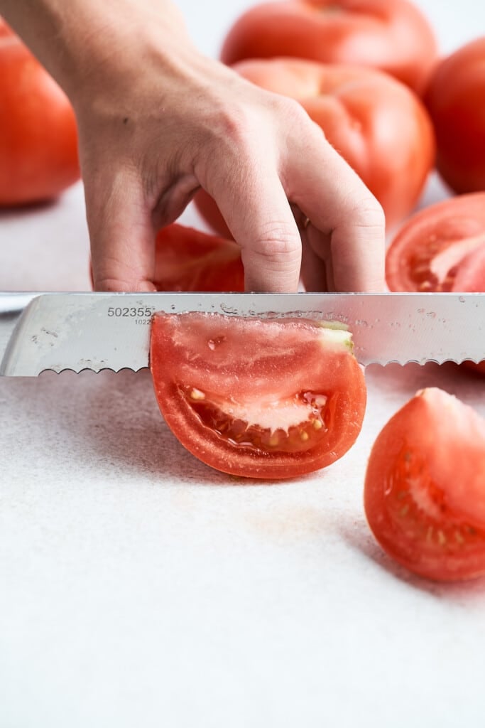 Cutting a tomato into wedges.