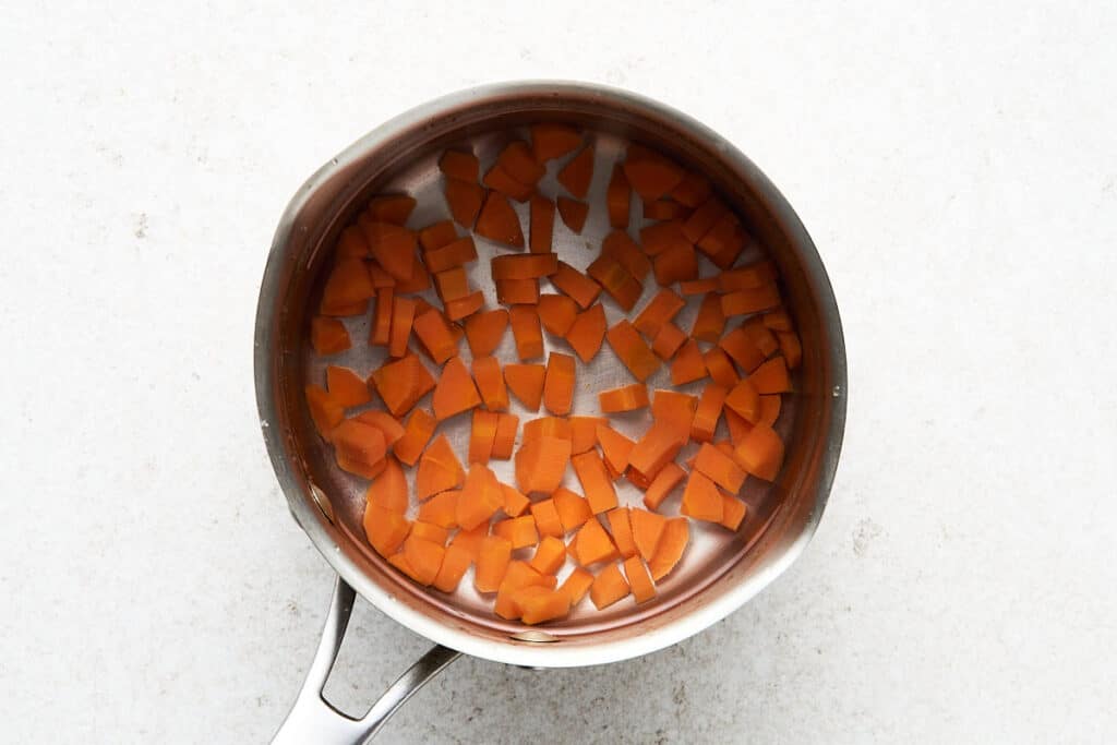 Boiling carrots.