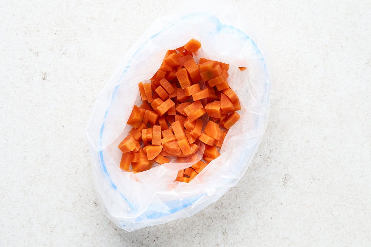 Storing carrots in a bag.