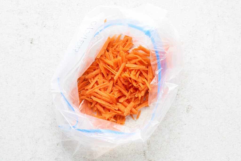 Shredded carrots in a bag.