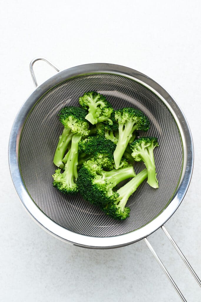 Drained blanched broccoli.