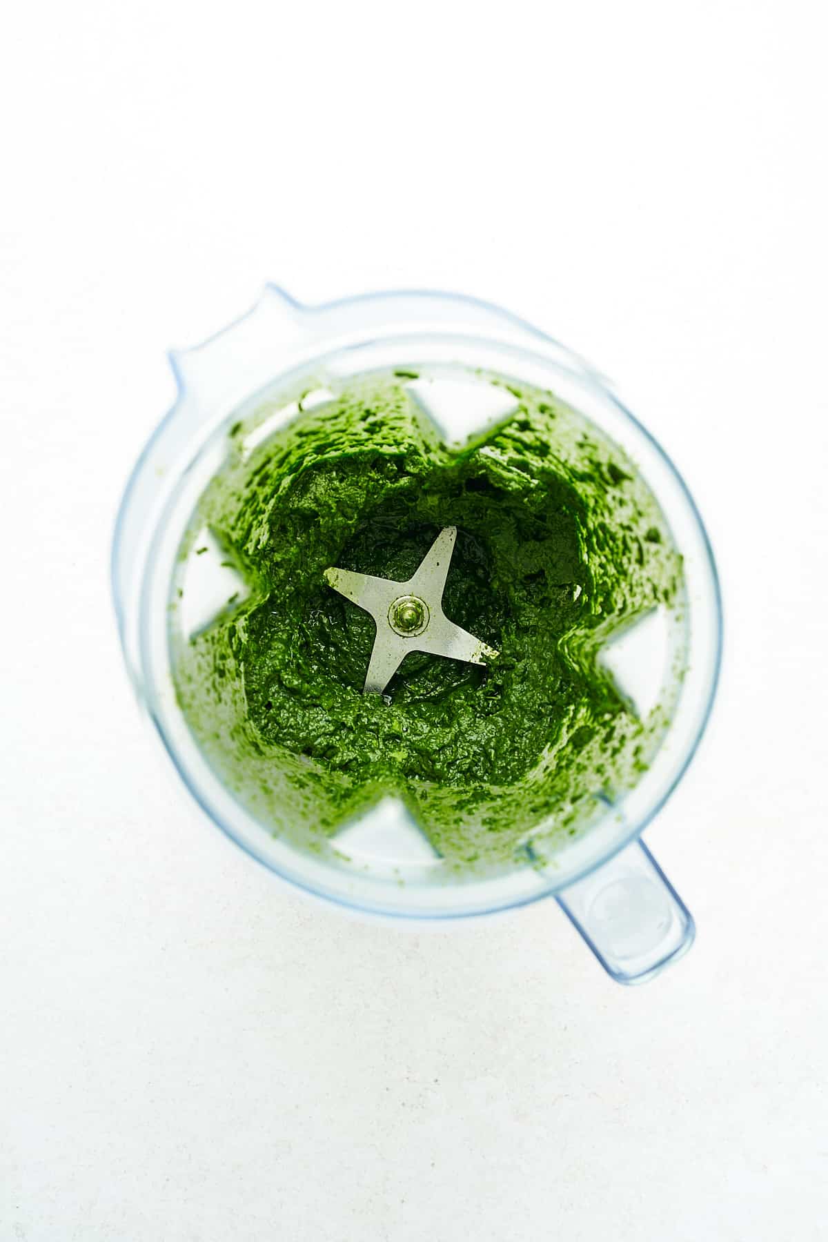 Pureed spinach in a blender.