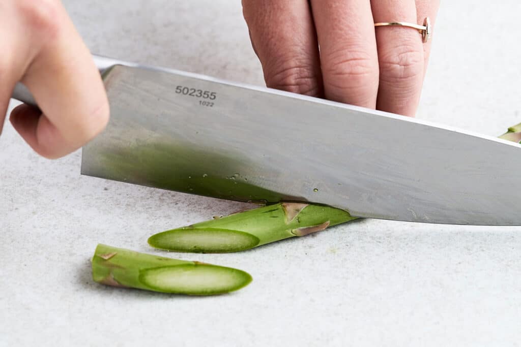 Cutting asparagus bias cut.