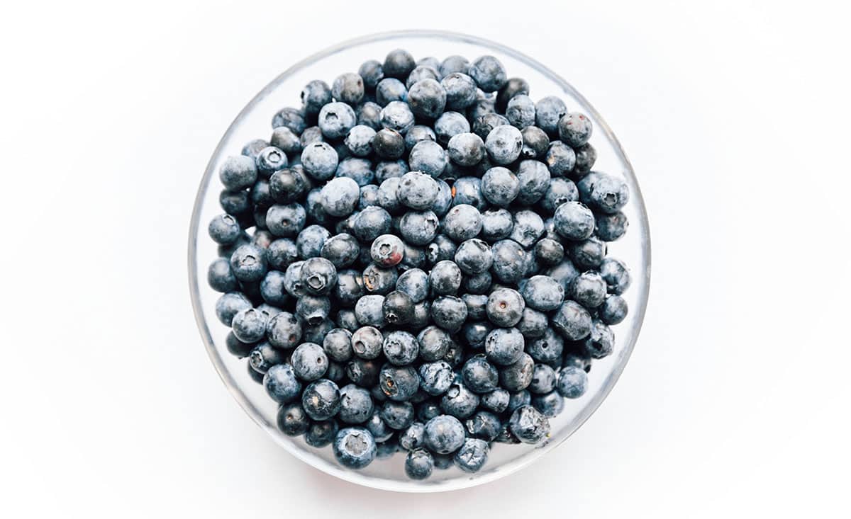 Closeup photo of blueberries in a bowl.