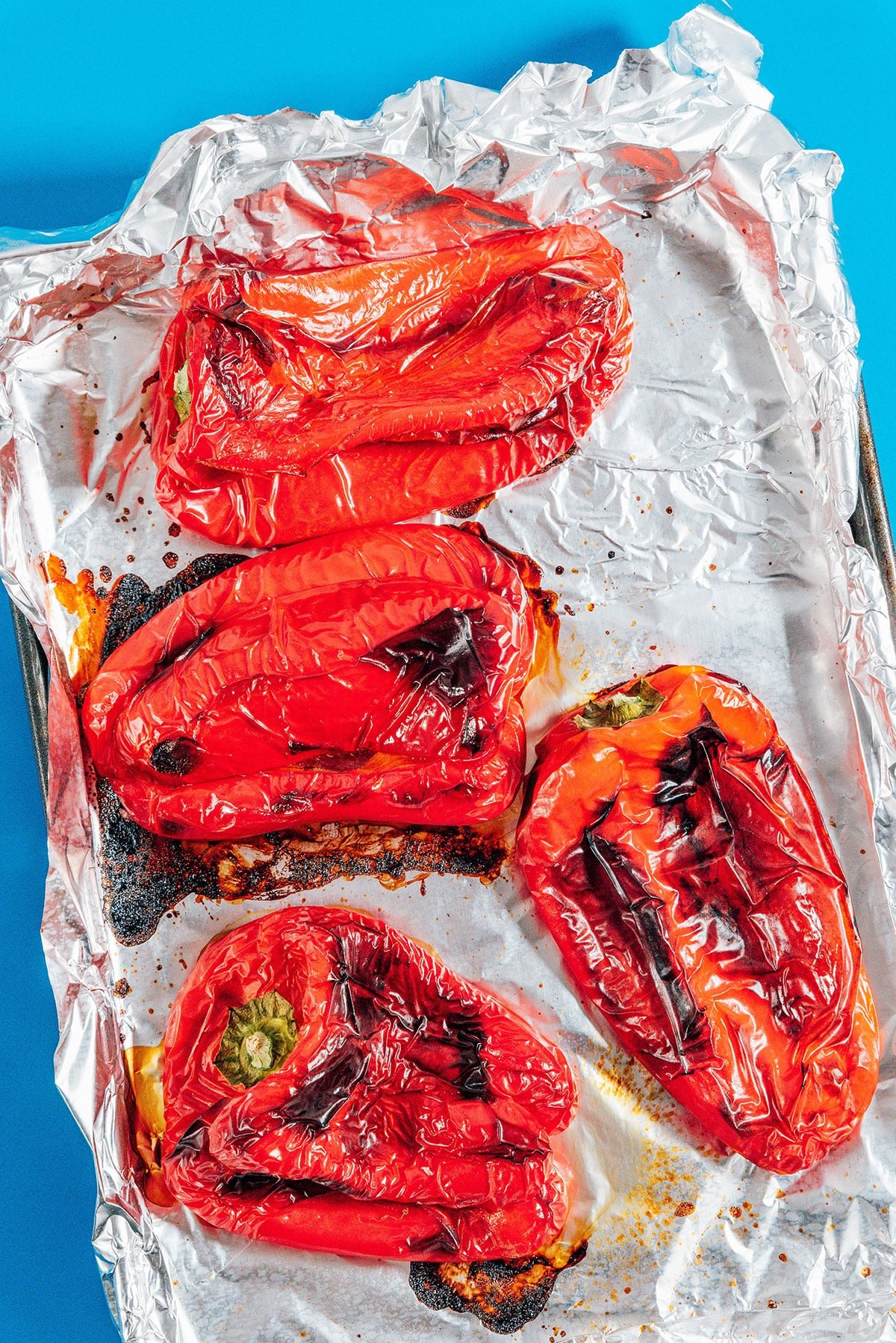 Roasted peppers on a sheet pan.