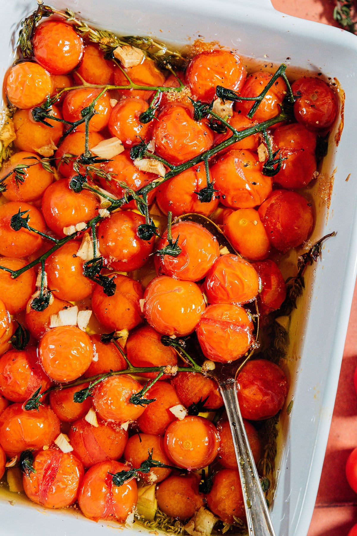 Tomato confit in a white baking dish.