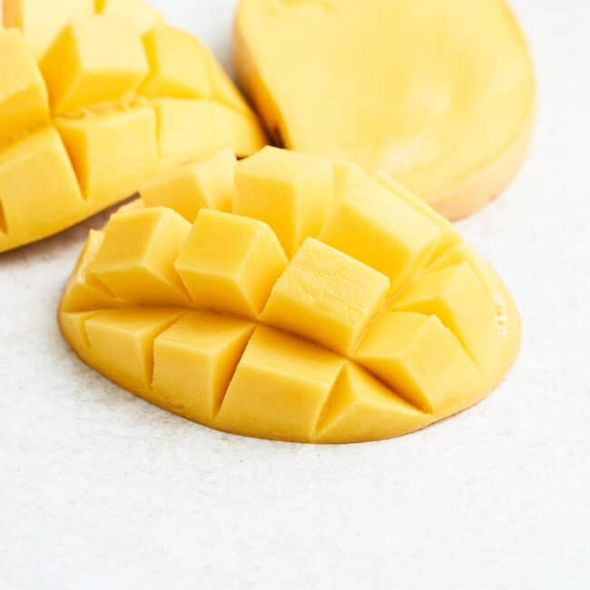 Cut mango in a hedgehog pattern.