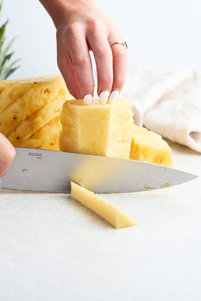 Cutting the core off a pineapple.