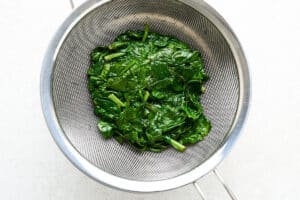 Freezing spinach by blanching it.