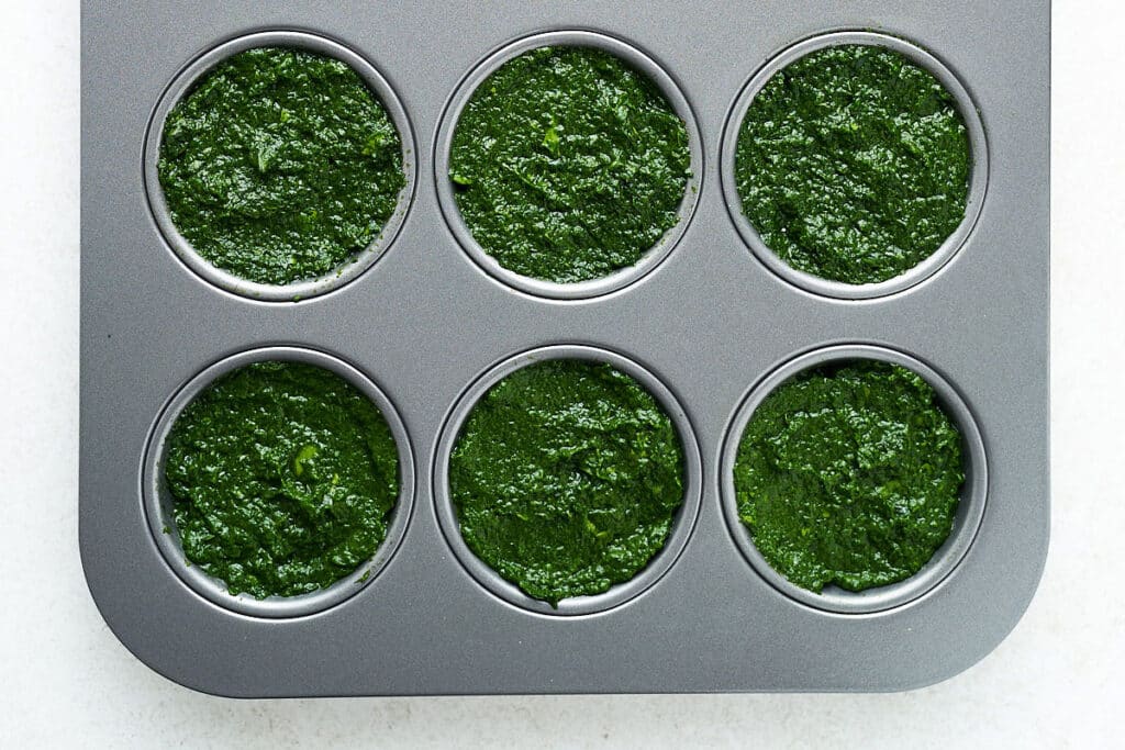 Freezing spinach by putting it in a muffin tin.