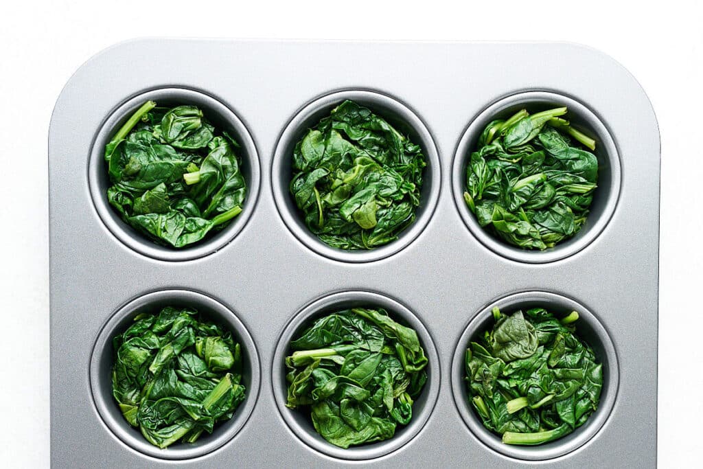 Freezing spinach by putting it in a muffin tin.