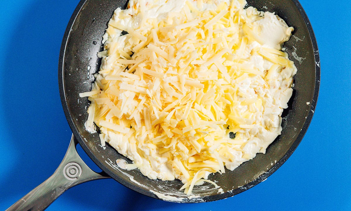 Cheese in a saute pan.