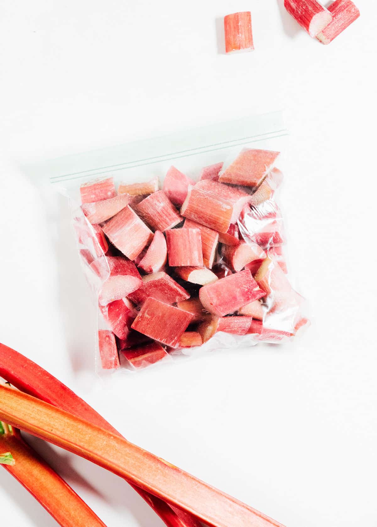 Bag of frozen rhubarb on a white background.