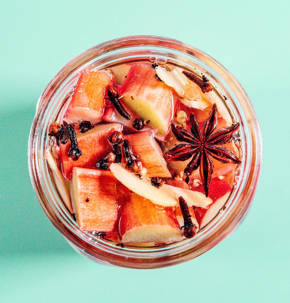 Pickled rhubarb in a mason jar with star anise.