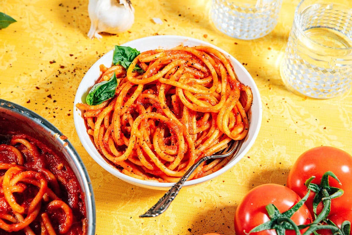 Pasta sauce in a bowl of spaghetti.