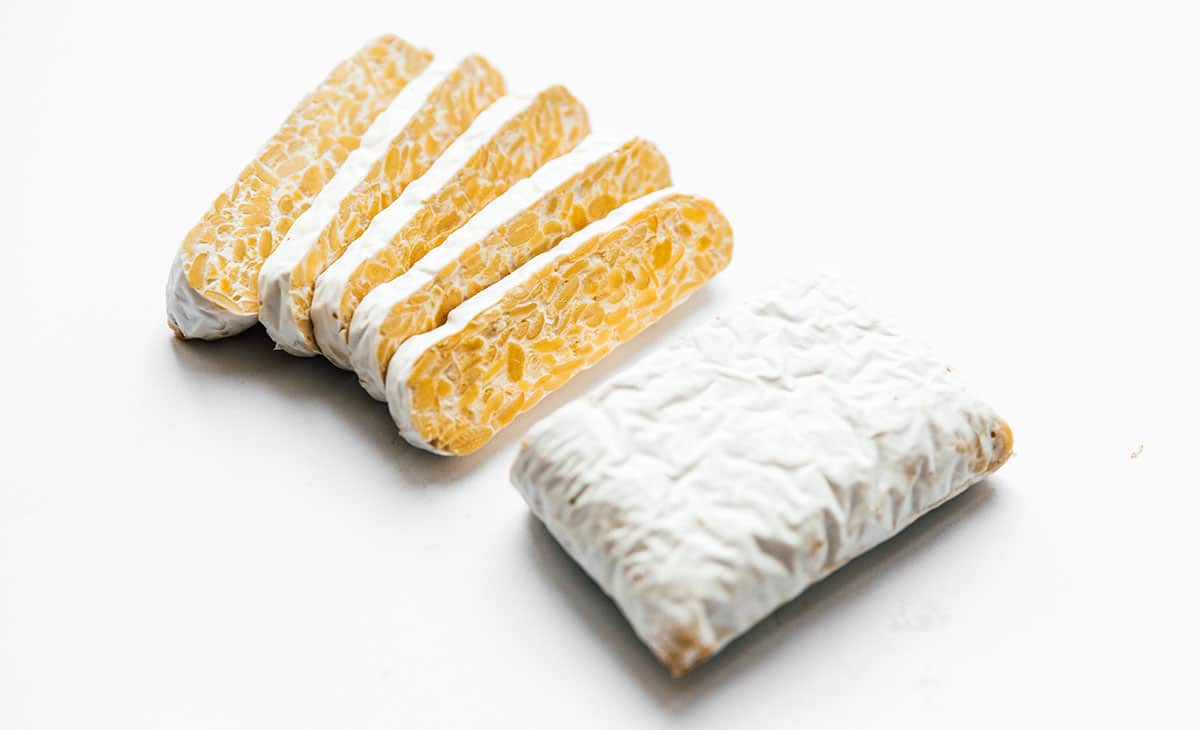 Picture of tempeh block on white background