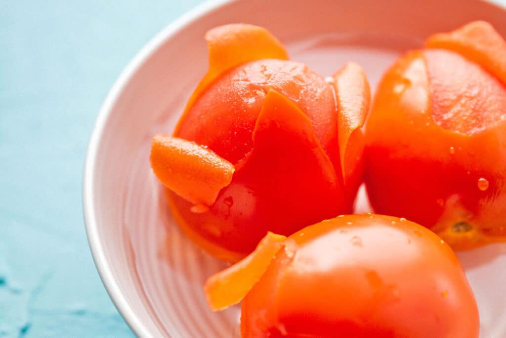 Blanching tomatoes.