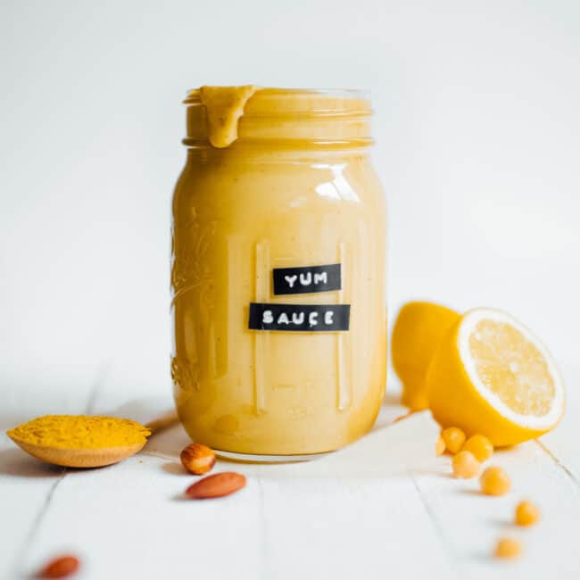 A mason jar filled with yum sauce and labeled.