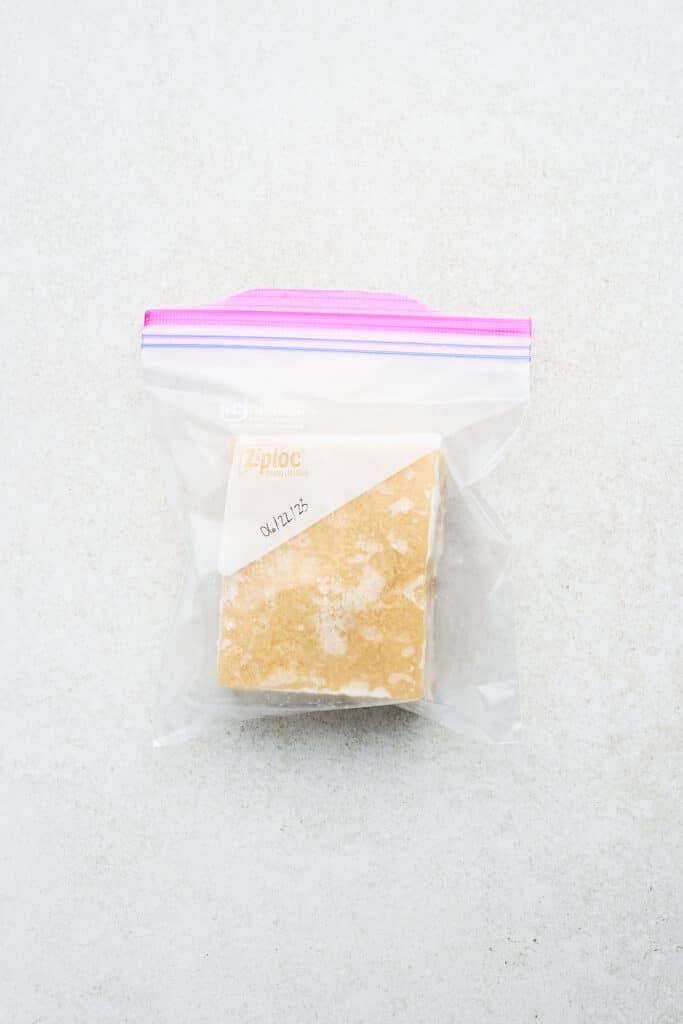 Frozen tofu in a bag.